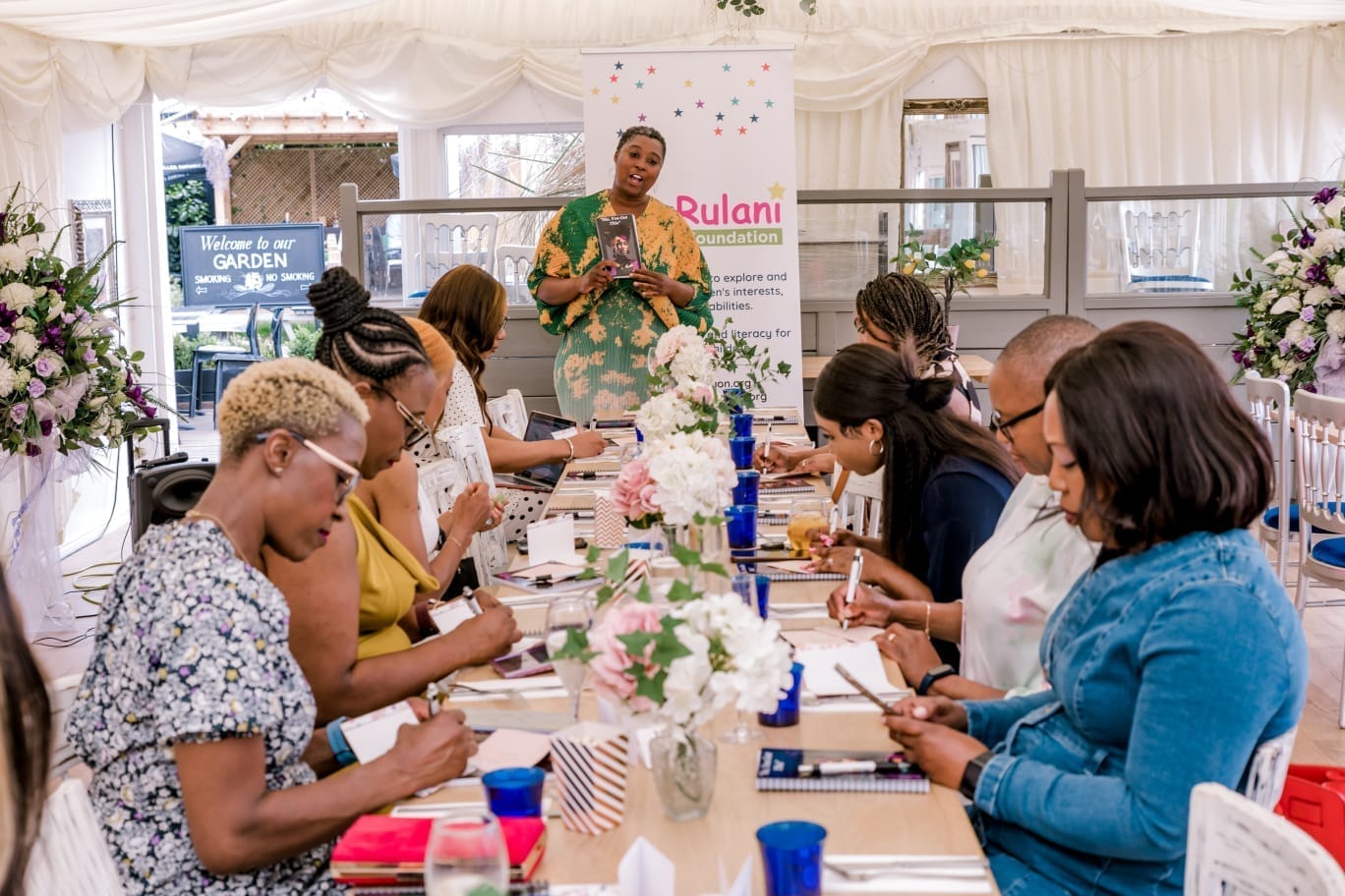 Rumbi leading a Lunch & Learn workshop with women